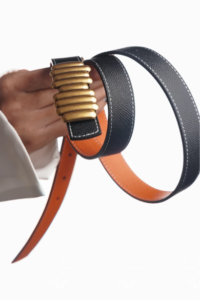 Wool belt with silver buckle on a white background