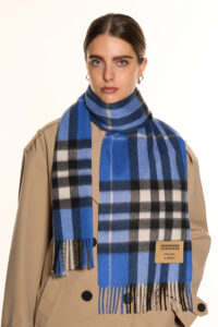 A romantic Valentine’s Day display of pure Scottish cashmere scarves in soft red and ivory tones, styled elegantly with gift boxes