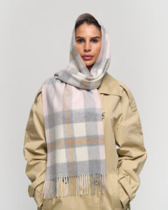 A beige cashmere scarf elegantly displayed in a premium gift box.