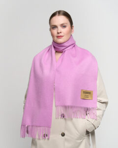 A luxury boutique display featuring the Lunar New Year collection of cashmere scarves.